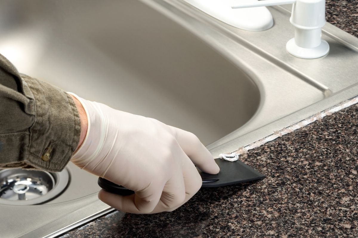 How to Caulk a Kitchen Sink Water Heater Hub